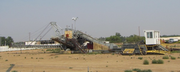 These were not pieces of mining equipment. Rather, they are used for piling sugar beets. At beet harvest, the beets are stored in gigantic piles near the factories, which run full-tilt to process the beets ASAP, before the sugar content declines too much.