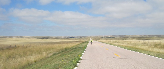 A rider southbound on Highway 71 passes through gorgeous High Plains scenery enroute from Agate Fossil Beds National Monument to Scotts Bluff National Monument.